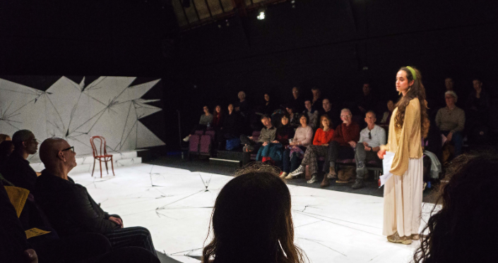 An audience watching an intimate performance in our Studio